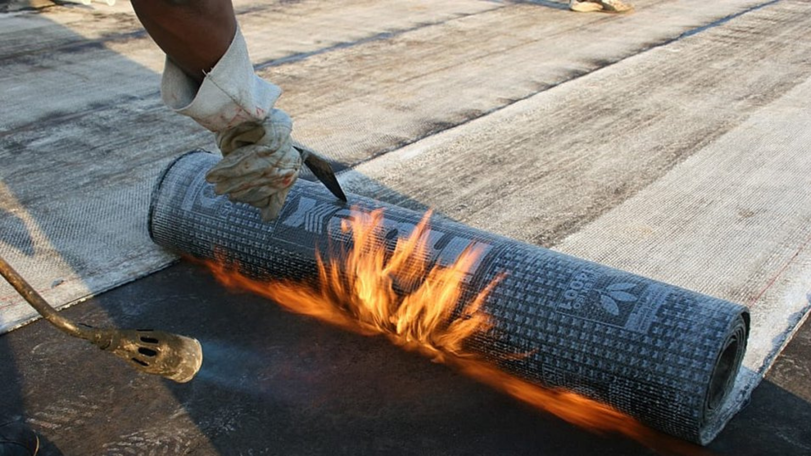 A beautiful suburban home with stone-coated steel shingles that look identical to traditional architectural shingles in a rich dark charcoal color.